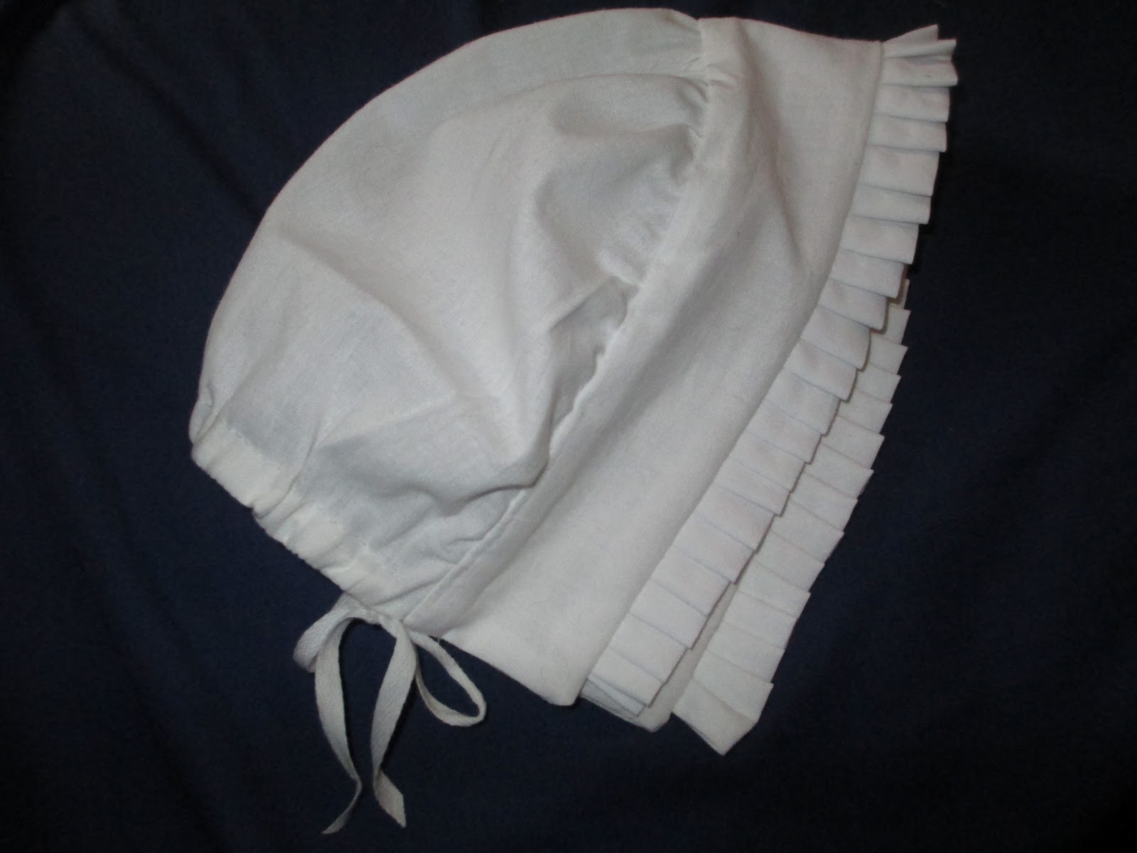 A Sartorial Statement A Muff And A Mob Cap