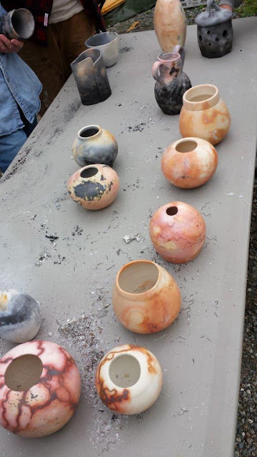 Foil saggar raku fired ceramic pots in a range of colors.