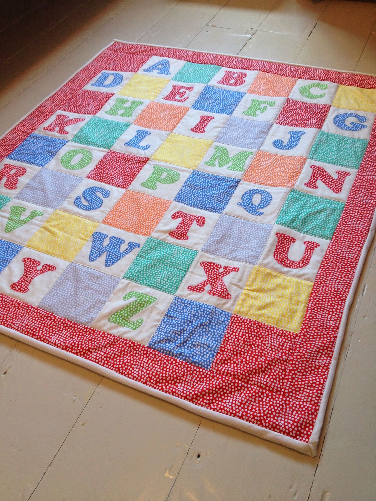 An alphabet mini quilt in Dashwood Studios 'Flurry' fabric Butterfly