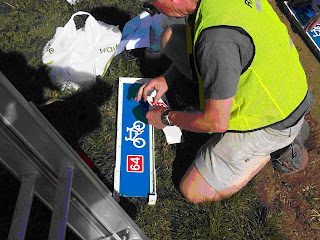 John Woodward affixes route patches John Woodward affixes route patches
