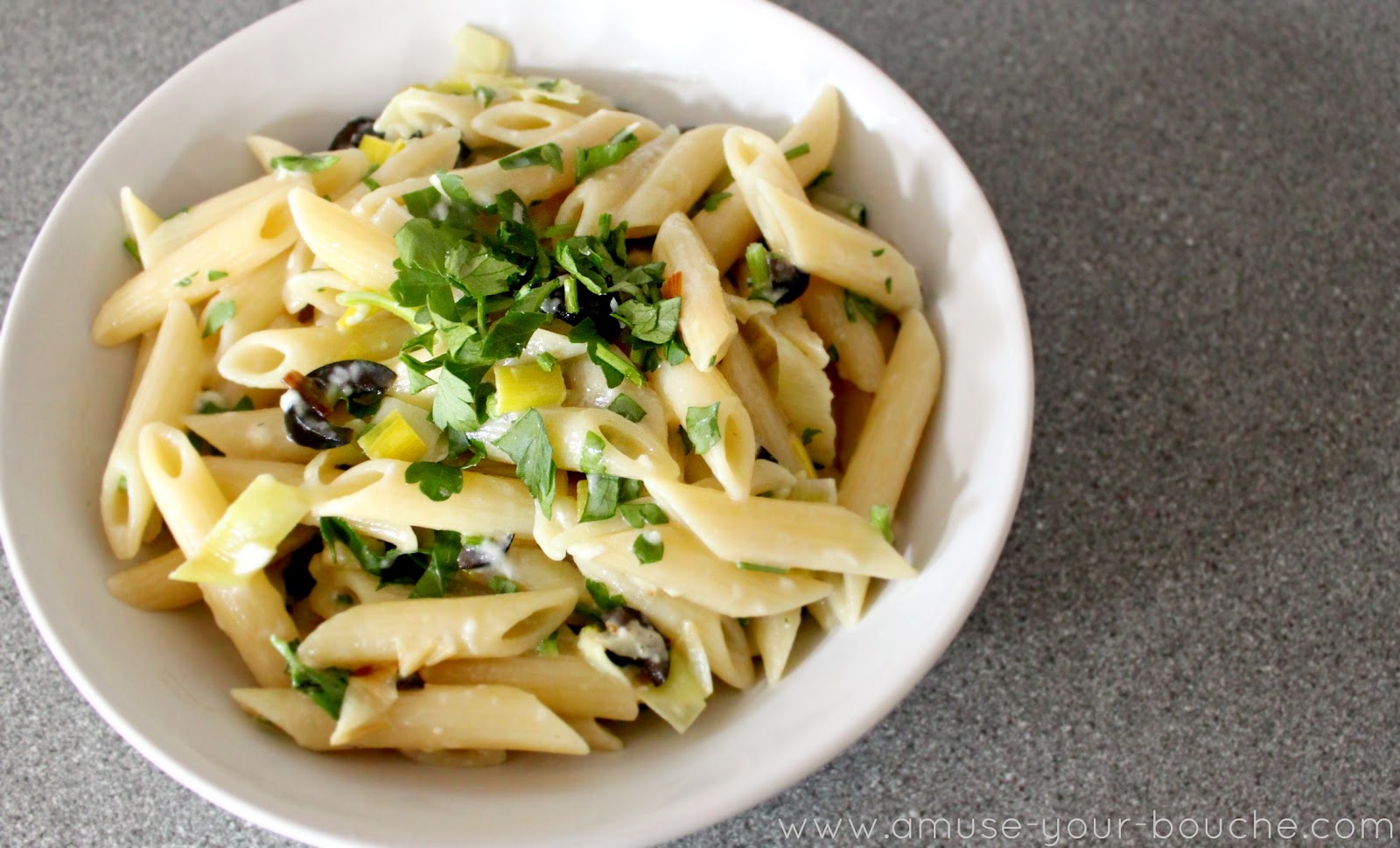 Vegetarian pasta carbonara with black olives and leek ...