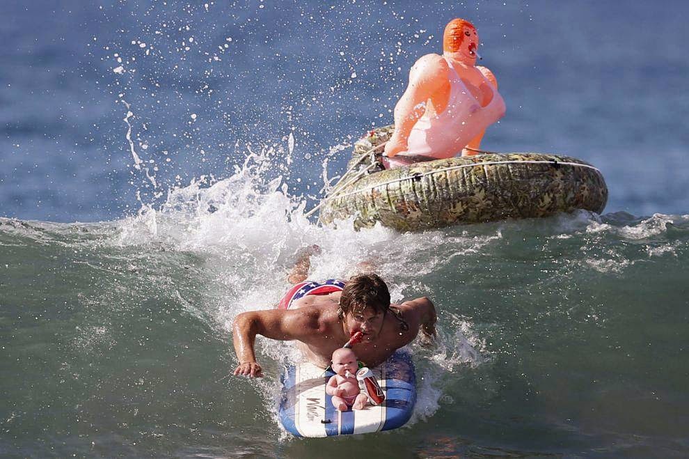 Halloween Surf Contest 2014 John Broz, 28, rides a wave in a costume entitled 'The redneck yacht club' during the 7th annual ZJ Boarding House Haunted Heats Halloween surf contest. (REUTERS/Lucy Nicholson)