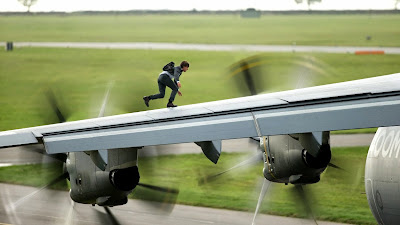 Tom Cruise on the wing of a plane in Mission Impossible Rogue Nation