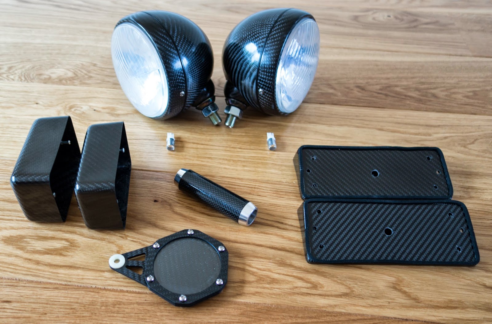 Caterham carbon accessories including headlights, rear light blocks, handbrake lever and tax disc holder