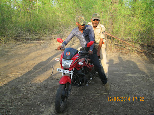 Forest police on motorcycle..