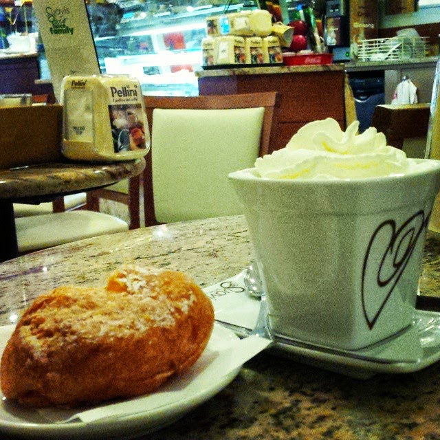 Hot chocolate with a fritella in a Vicenza cafe