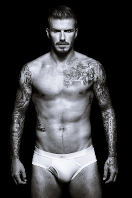 David Beckham in his pants showing off his tattoos