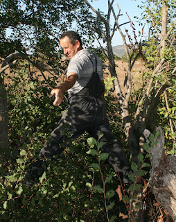 Balanced and reaching back for rope Balanced and reaching back for rope