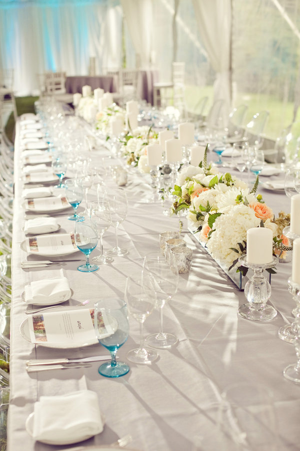 The silver linens give this impeccable floral and table arrangement a 