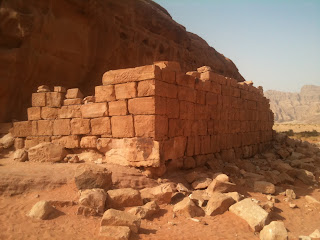 a stone wall in the desert