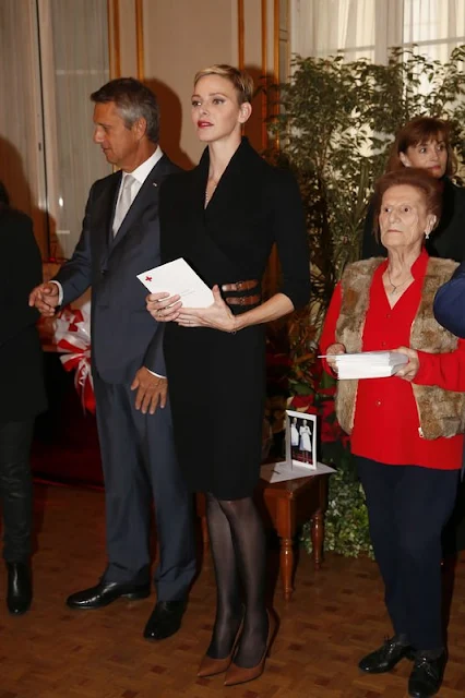 Prince Albert II of Monaco and Princess Charlene of Monaco attends parcels distribution at the Monaco Red Cross headquarters 