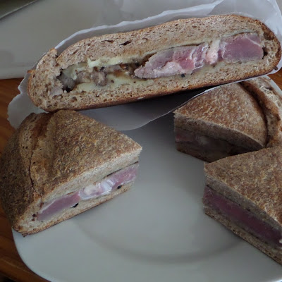 Steak and Cheese Shooter's Sandwich:  A crusty bread boule stuffed with steak and cheese then pressed.  A very hardy sandwich.