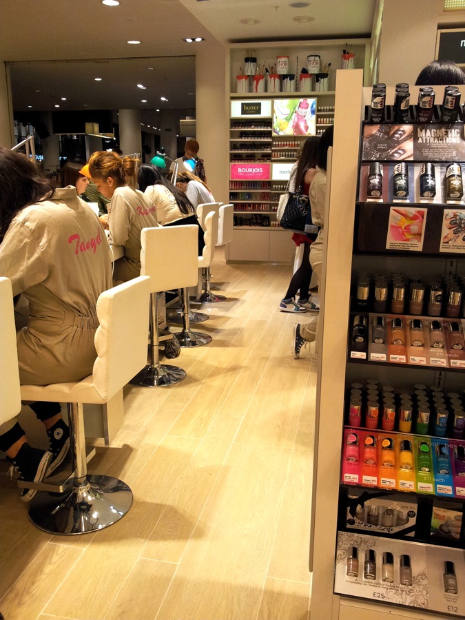 The nail bar was brimming with customers. It offers Nails Inc,