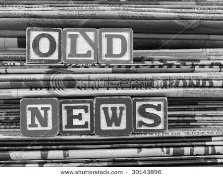 stock-photo-old-newspapers-stacked-from-the-top-to-bottom-filling-the-frame-and-old-news-is-written-in-block-30143896.jpg