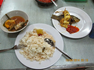 Classic "Indonesian Buffet Dinner" of fish and rice.