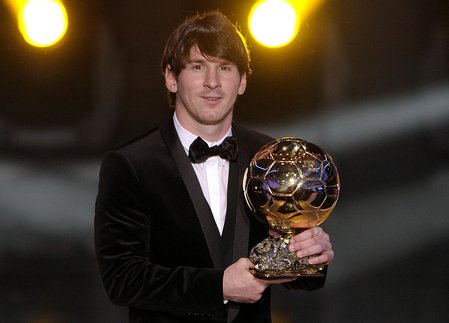 Lionel Messi with Ballon d'Or Award
