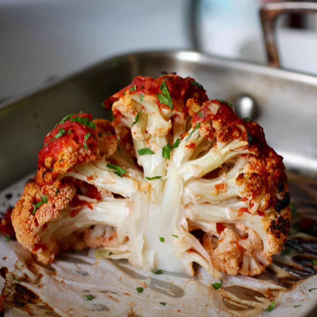 Green Gourmet Giraffe Whole roasted cauliflower wih tomato broth