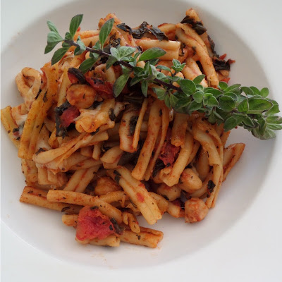 Spinach Pasta Bake:  A vegetarian one dish meal of pasta and tomato sauce, with spinach and garbanzo beans, baked with mozzarella.