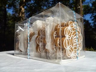 highly decorated gingerbread cookies in a crystal clear box