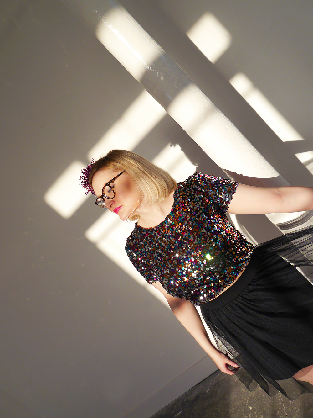 Kimberley from Wardrobe Conversations in full sequin party look sequins, sparkly New Year outfit, how to wear sequins, glitter ball outfit, Christmas party, ballerina skirt, IOLLA Muir glasses, tinsel hair clip