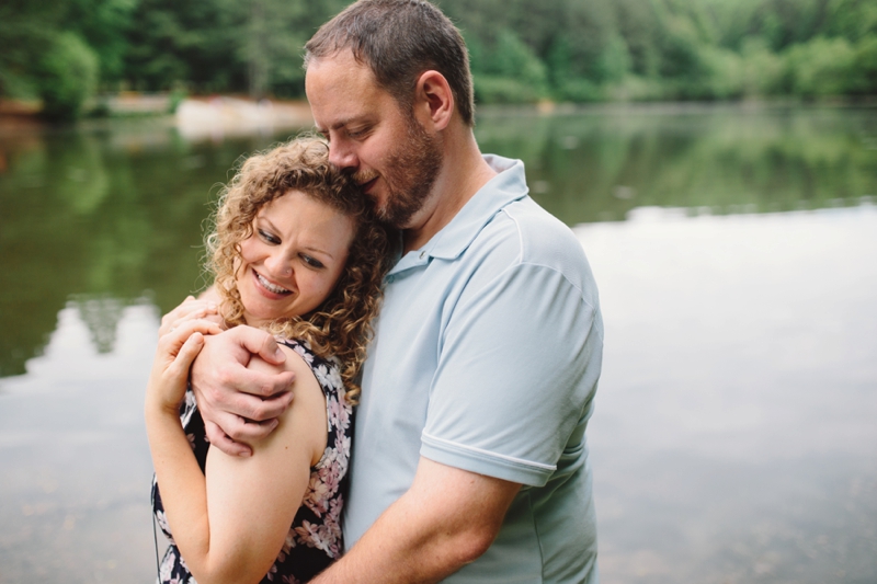 couple by the lake for their atlanta engagement photos