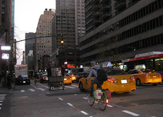 Bicycles in a bike lane alongside taxis, New York, New York