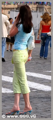 Girl in light-green breeches on the street 