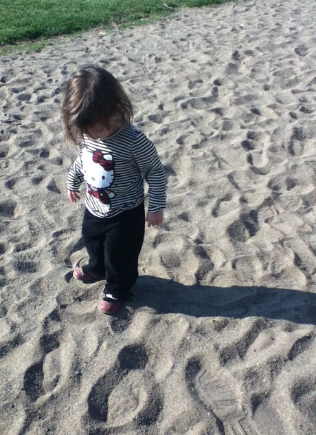 Preschooler in the sand at the park. My preschooler playing in the sand at the park.