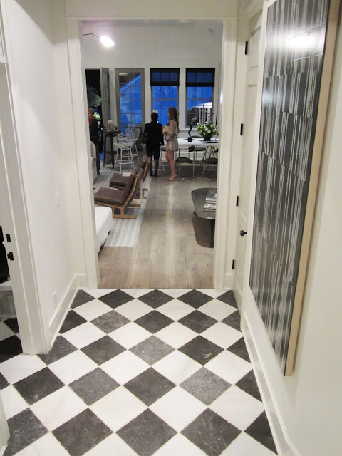 Hallway in the Windsor House with a black and white checkerboard marble floor
