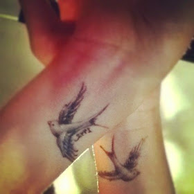 ♥ ♫ ♥ Swallow wrist tattoos. The swallow is a bird that chooses a mate for life and will only nest with that bird and no other. Therefore a swallow tattoo is also a symbol of love & loyalty. Swallow pairs travel long distances, only to find their way back to each other at home. ♥ ♫ ♥
