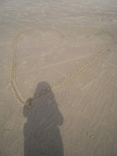 Photo of heart drawn in the sand
