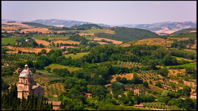 Sublime Tuscan countryside replete with rolling hills of olive groves and vineyards, dotted by villas and this  church. Photo: Guillen Perez.