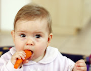 Baby eating carrot. Nice carrot mmmmmmm! baby eating carrot