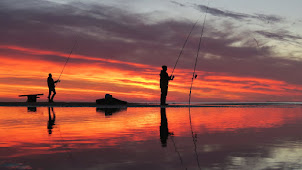 Anglers at sunset at Katwijk Beach