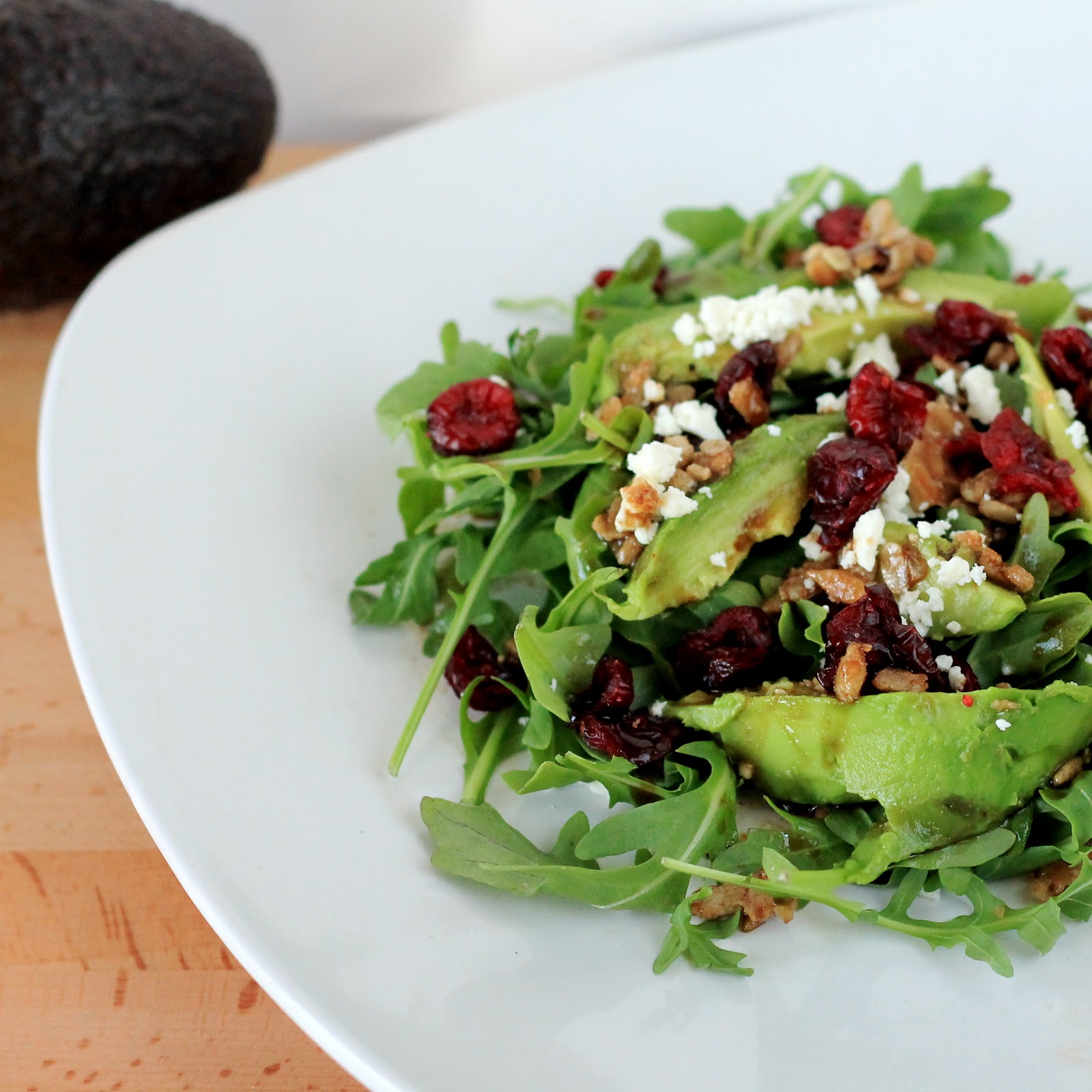 Celebrating Happy Cranberry Avocado Salad with Candied Sunflower Seeds
