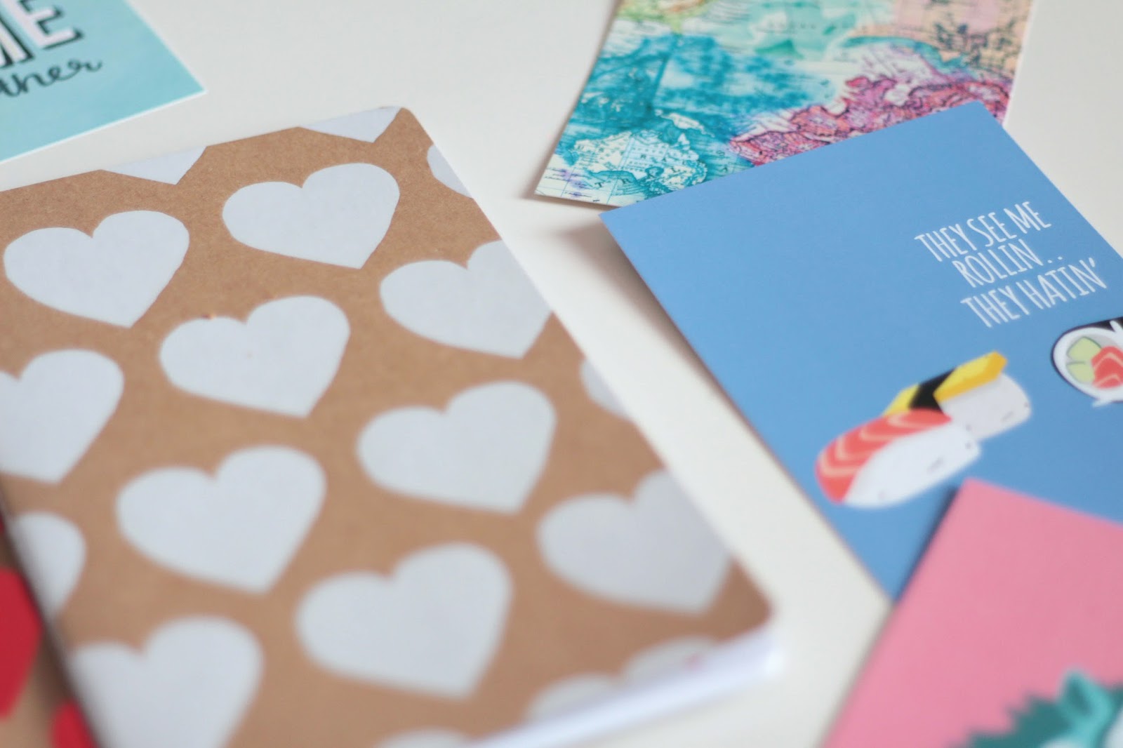 desk lay paperchase notebooks and postcards