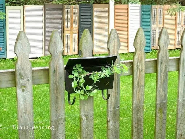 One cool repurposed shutter and old door fence - Diana Wearing