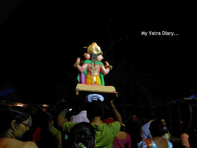 A Ganesh idol taken on head for Ganesh Visarjan, Mumbai