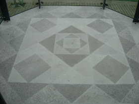 Geometric patterned floor using two Limestones in a glass conservatory
