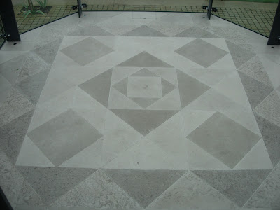 Geometric patterned floor using two Limestones in a glass conservatory