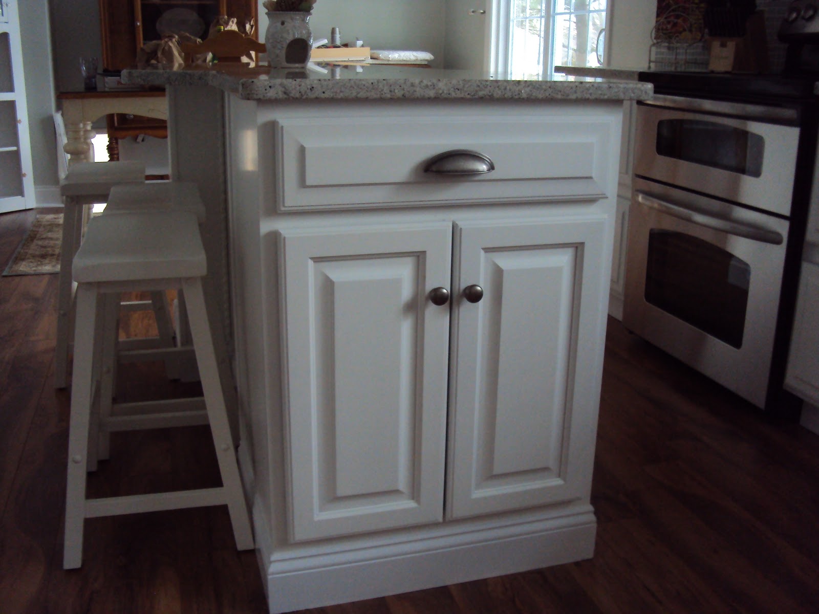 Cottage Beach House The kitchen Island, a Hutch design and French Doors