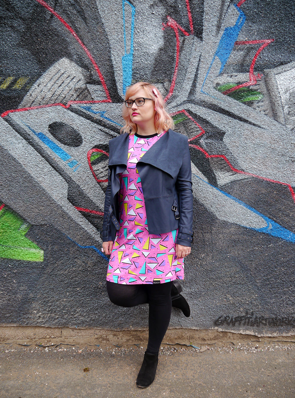 Dreamland Duplex print dress, Saved by the Bell style, pom pom earrings, Alternate Normality candyfloss hairclip, River Island leather jacket, street style with graffiti