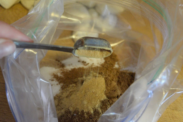 Ground ginger being added to the resealable bag.  