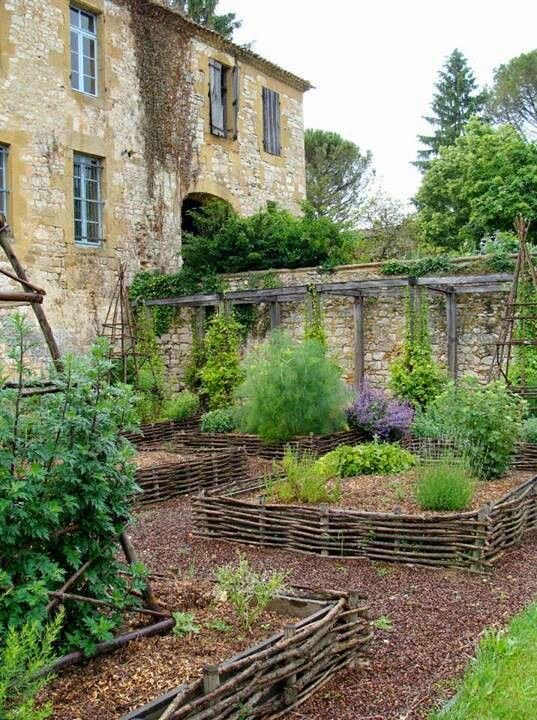 Medieval walled garden with woven raised beds / Magic Garden A