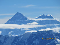 Mt. Everest (left) in early morning light on recreational fly-by from Kathmandu Valley, Nepal