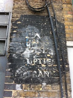 Ghost sign in Garden Walk, Shoreditch, London EC2