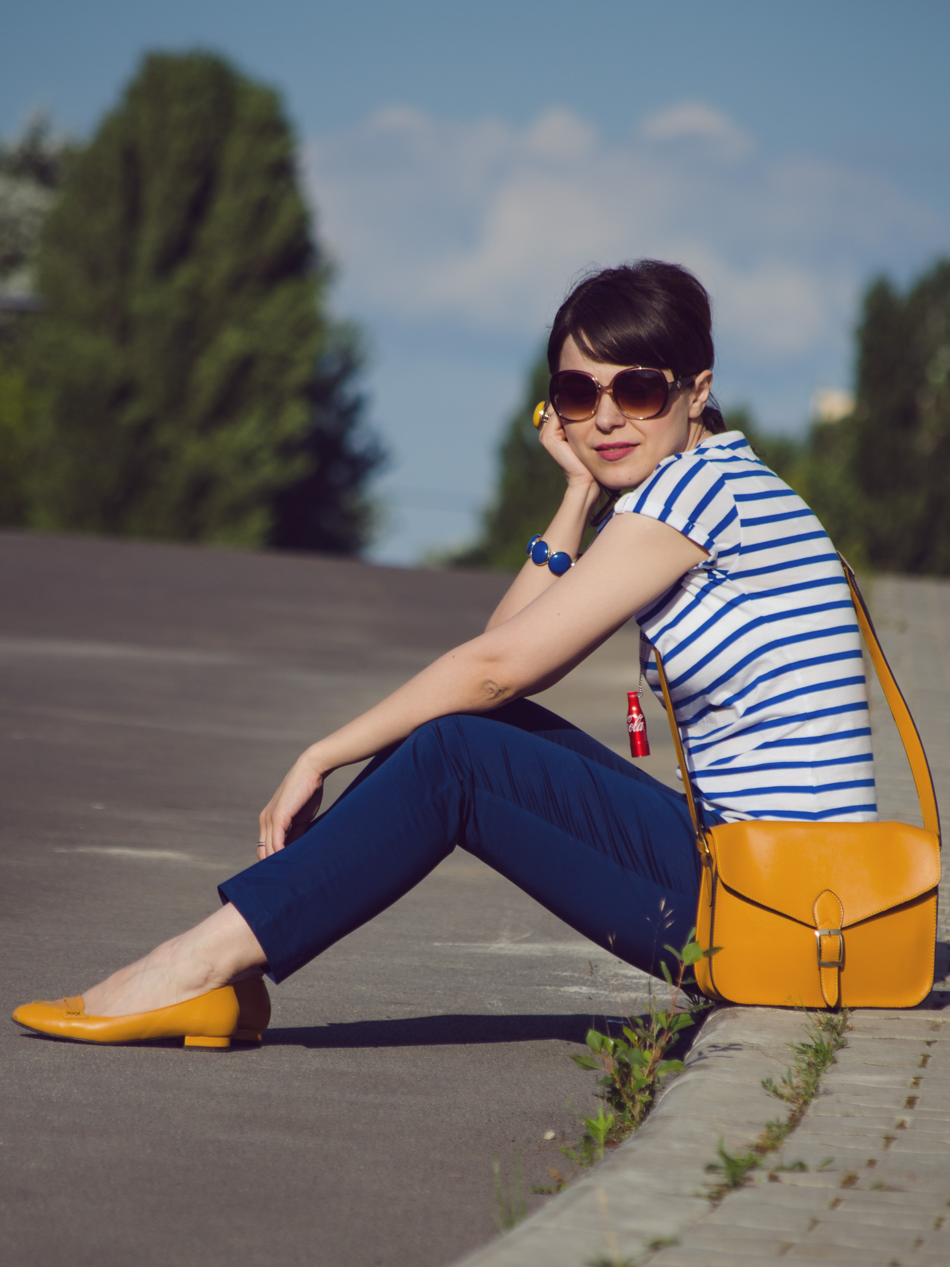 navy pants blue stripes t-shirt mustard bag flats jeans jacket coke little bottle