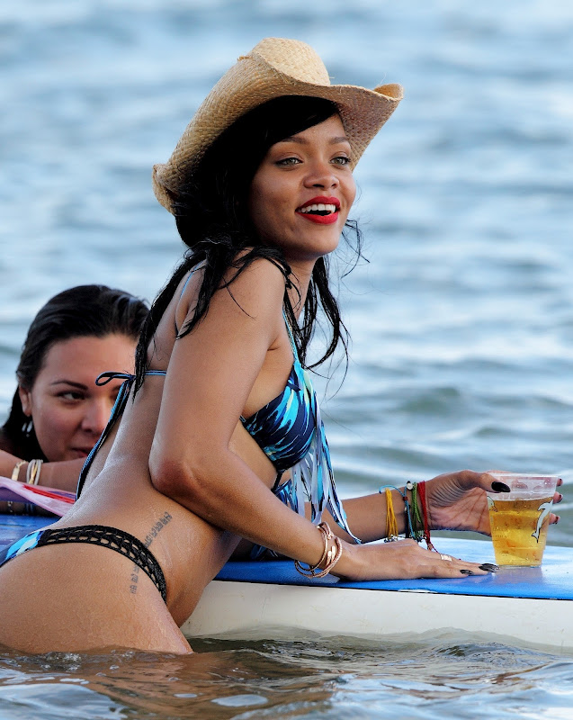 Rihanna has a few drinks on a paddle board with her friends