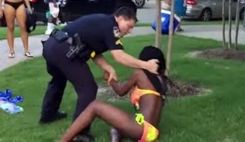 American Policeman  assaults a black teenage girl