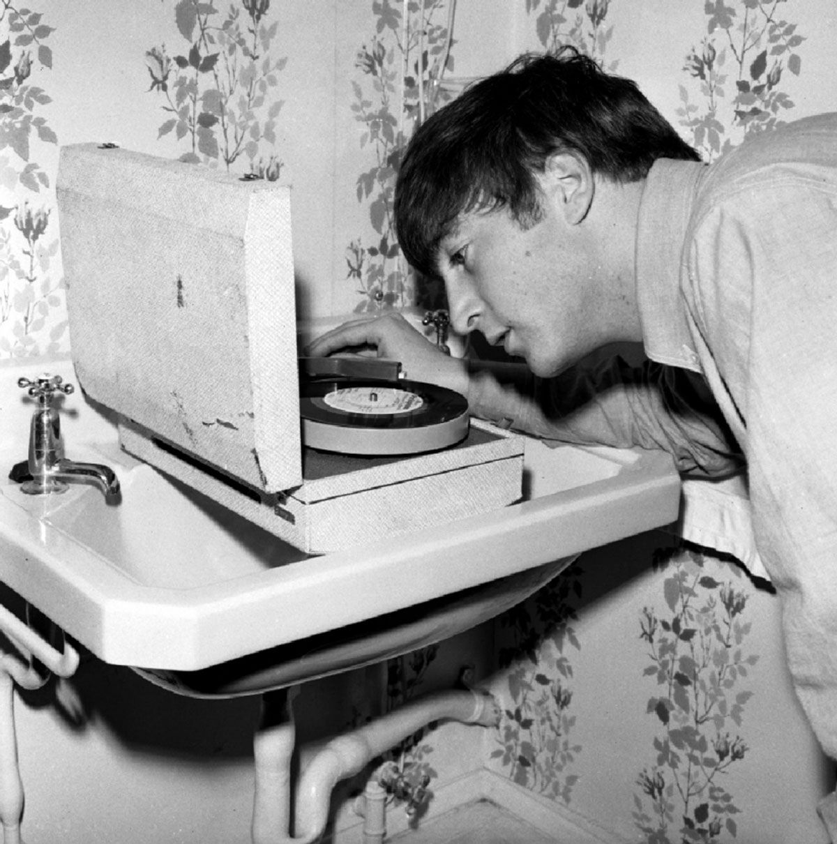 John Lennon playing records in the sink. That's right!